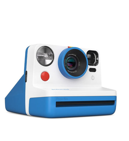 Polaroid instant camera in blue with dimensions 11.2 x 9.4 x 15 cm, electronic photography device.