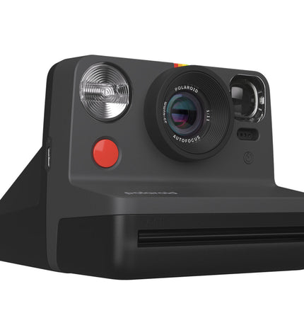 Polaroid Instant Fotocamera 009095 in black with lens, viewfinder, and shutter button, ready for instant photography.