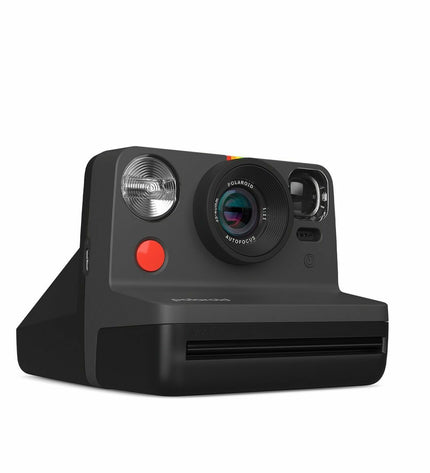 Polaroid Instant Fotocamera model 009095, compact electronic camera with viewfinder and shutter button, in a sleek design.