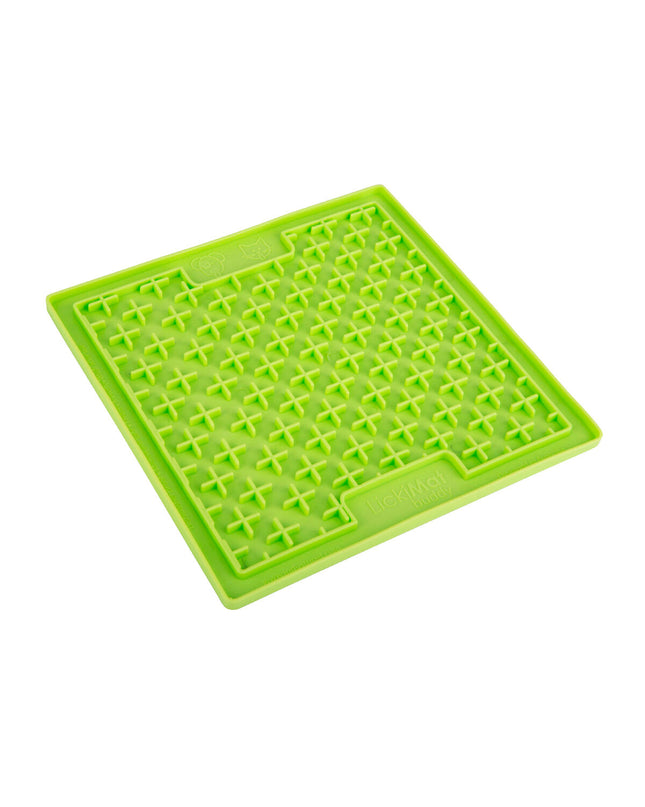 Green TPR dog lick mat in a dog bowl for dogs, from Lickimat, designed for interactive feeding and soothing canine comfort.