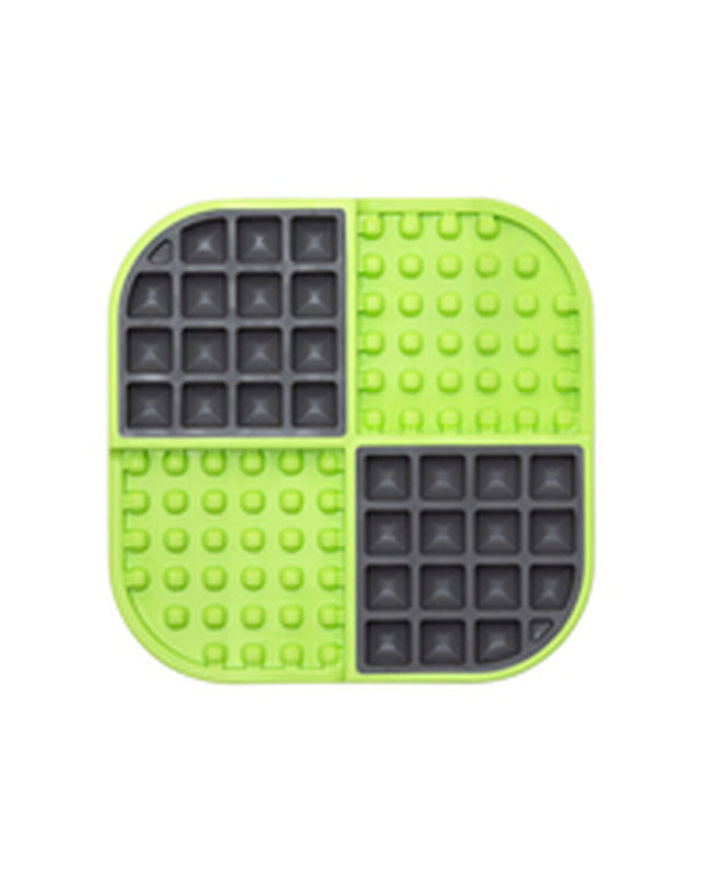 Green Lickimat dog feeding tray made of polypropylene and TPR for dogs, designed to slow feeding and reduce boredom.
