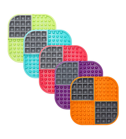 Green Lickimat Slomo dog feeding tray made of polypropylene and TPR, designed for dog enrichment and slow feeding.