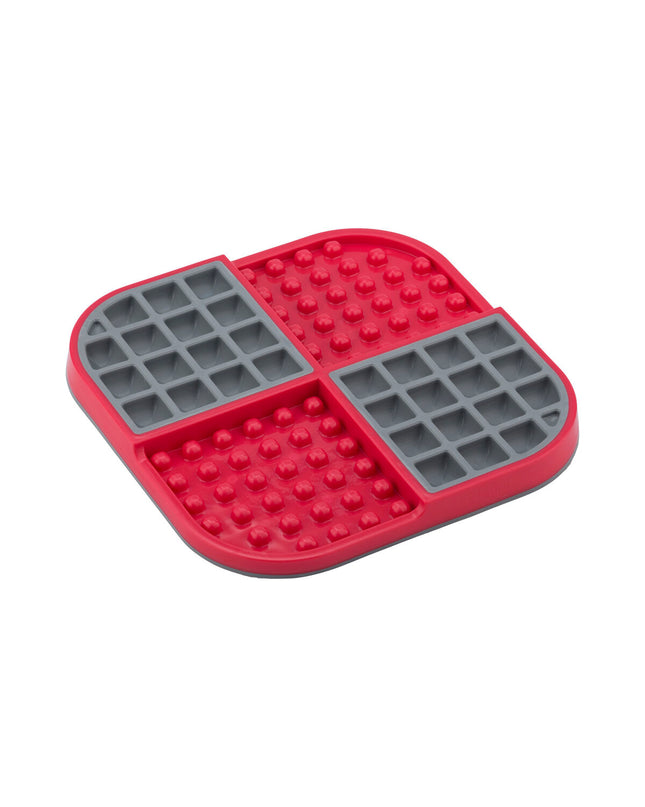 Red Lickimat dog feeding bowl made of polypropylene and TPR, designed for dogs to lick and play with.