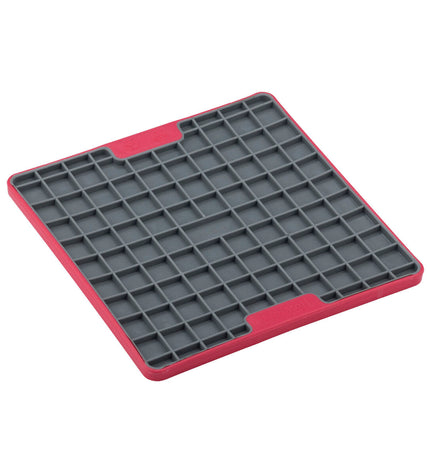 Red Lickimat dog feeding tray made of polypropylene and TPR, designed to slow down eating and keep dogs entertained.