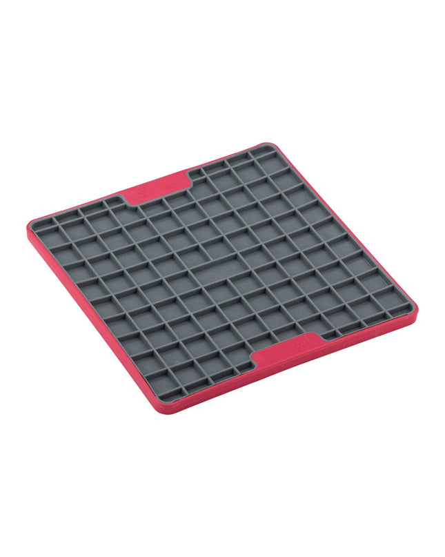 Red Lickimat dog feeding tray made of polypropylene and TPR, designed to slow down eating and keep dogs entertained.