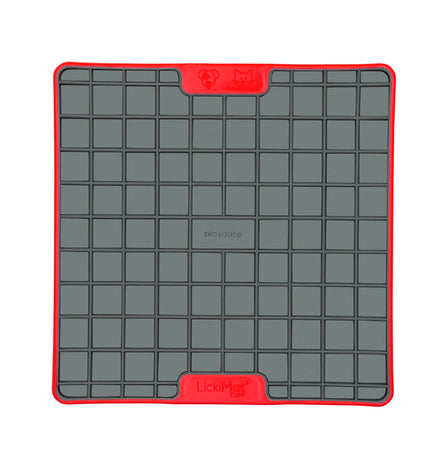 Red Lickimat dog feeding bowl made of polypropylene and TPR, designed for dogs to lick and enjoy.