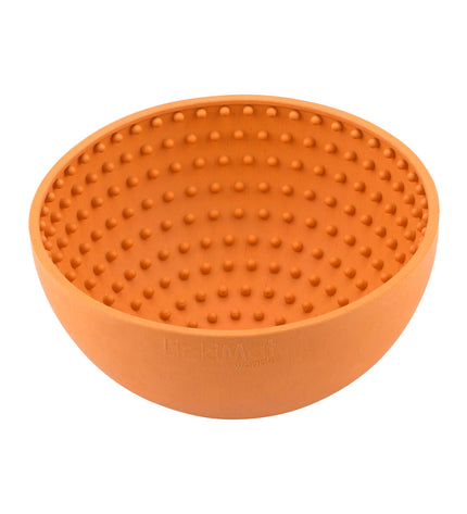 Orange rubber dog lickimat wobble feeder with textured surface, designed for dog enrichment and interactive feeding.