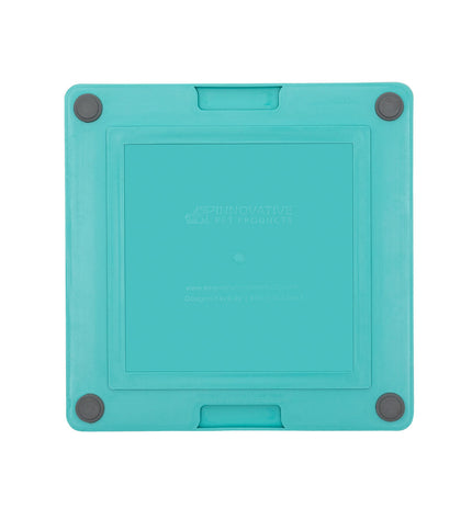 Turquoise Lickimat dog feeder made of durable polypropylene and TPR, designed for dogs to lick and play.