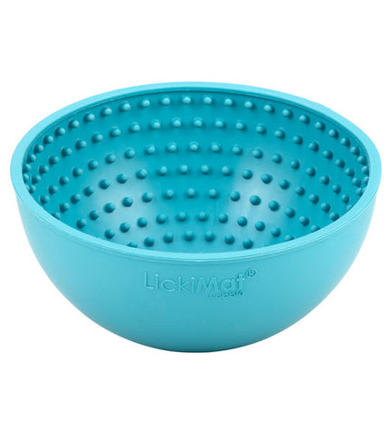 Lickimat Wobble dog treat dispenser in turquoise rubber for dogs, with a textured surface for interactive feeding.