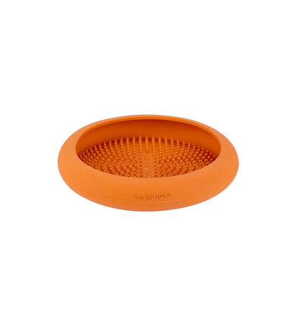 Orange rubber Lickimat dog feeding tray with textured surface for dogs, designed by Lickimat for modern pet feeding.