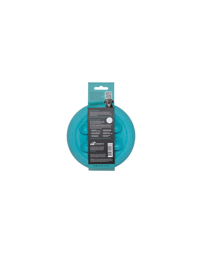 Turquoise rubber dog lick mat with textured surface, designed for canine feeding and enrichment by Lickimat.