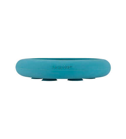 Turquoise rubber dog lickimat feeding tray for dogs, designed to keep pets engaged and calm during mealtime.