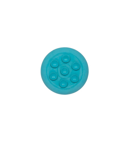 Turquoise rubber dog lick mat from Lickimat, designed for dogs to lick and chew, made of durable, flexible material.