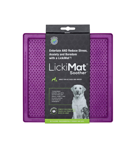 Purple TPR dog lick mat on a white surface, designed for feeding and calming dogs, with textured surface for pet enrichment.