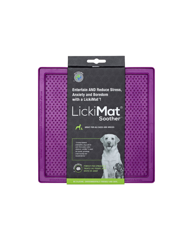 Purple TPR dog lick mat on a white surface, designed for feeding and calming dogs, with textured surface for pet enrichment.