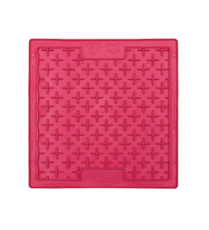 Pink TPR dog lick mat with raised surface for dogs, designed by Lickimat, used for feeding and soothing pets.