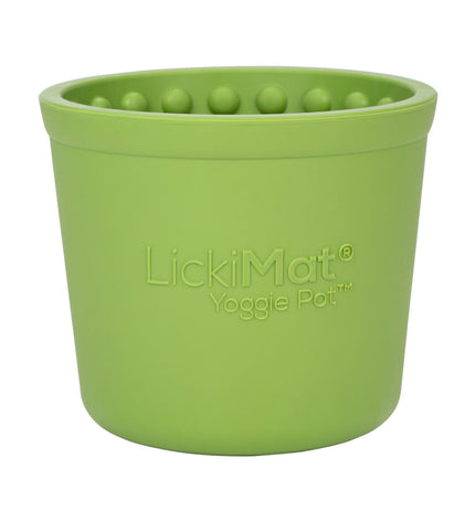 Green rubber Lickimat dog feeding tray with textured surface designed for canine licking and feeding activities.