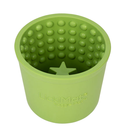 Green rubber dog lick mat from Lickimat, designed for feeding and soothing dogs, with textured surface for licking and chewing.