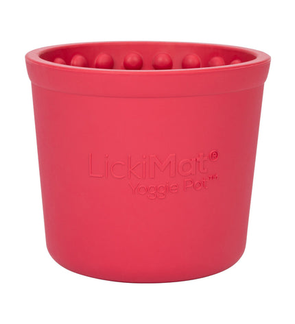 Pink rubber dog lickimat for feeding and boredom relief, branded Lickimat, showing textured surface for dogs.
