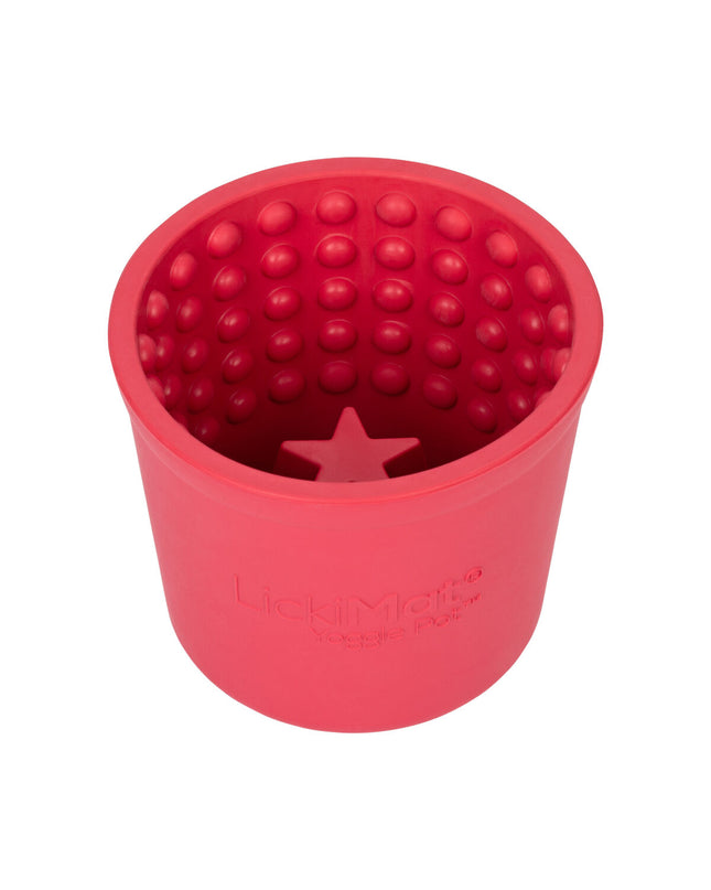 Pink rubber dog lickimat tray designed for dogs, with textured surface for soothing and feeding activities, by Lickimat.