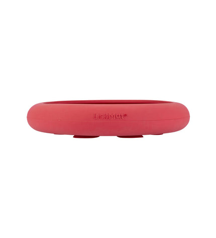 Pink rubber dog lickimat feeding tray, designed for dogs, with textured surface for licking and puzzle feeding.