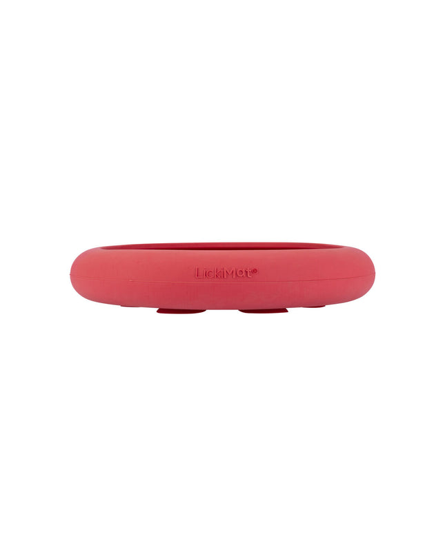 Pink rubber dog lickimat feeding tray, designed for dogs, with textured surface for licking and puzzle feeding.
