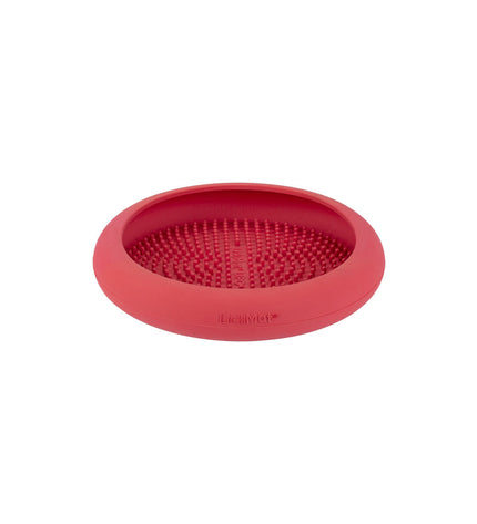 Pink rubber dog lickimat feeding tray for dogs, designed to soothe and entertain pets with textured surface.