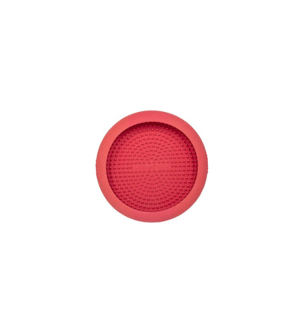 Pink rubber dog lickimat feeding tray for dogs, designed to provide mental stimulation and slow feeding for pets.