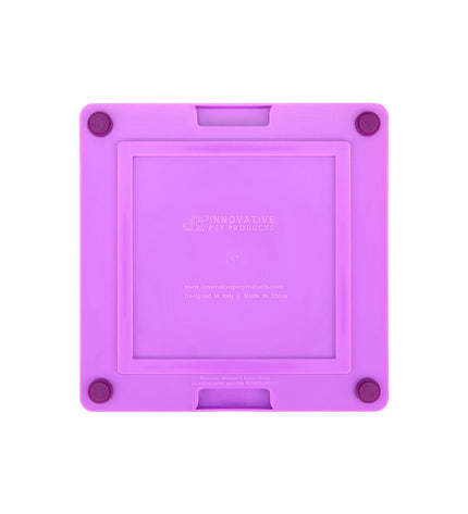 Purple Lickimat dog feeding tray made of polypropylene and TPR, designed to keep dogs engaged and calm during feeding.