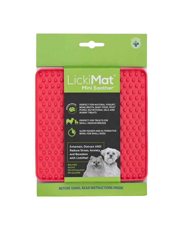 Pink TPR dog lickmat in a dog product image, designed for use with dogs to promote licking and calming.