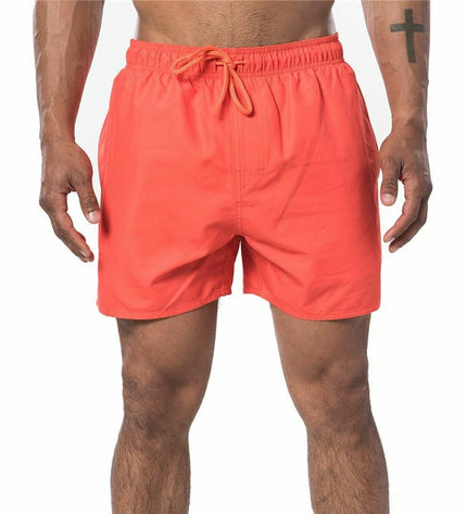 Red Rip Curl men's swim trunks featuring offset volley design, suitable for sport and outdoor water activities.