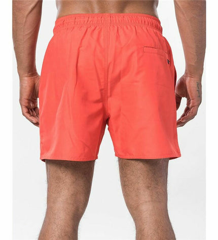 Red Rip Curl men's swim trunk with offset volley design, suitable for sports and outdoor water activities.