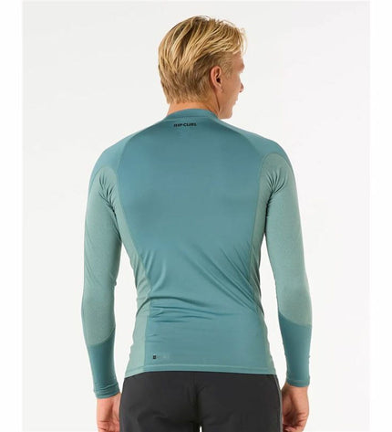 Rip Curl Waves Upf long-sleeve blue T-shirt, sports and outdoor watersport apparel with rip and wave design.