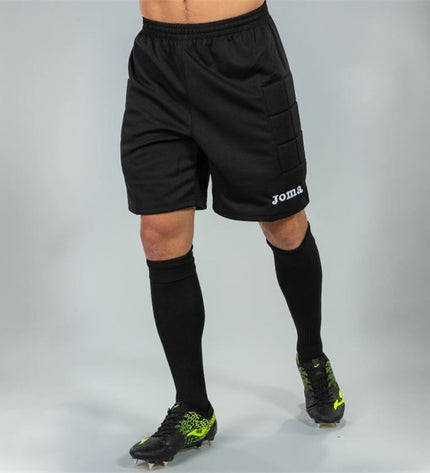 Joma Sport goalkeeper football pants with protective padding, designed for outdoor soccer, shown in black with logo details.