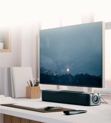 Creative Technology wireless soundbar in black with 48W output, compact electronic audio device for enhanced TV sound.