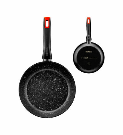 Monix aluminium pan for home cooking, showing a close-up of the pan's exterior with a sleek silver finish and ergonomic handle.