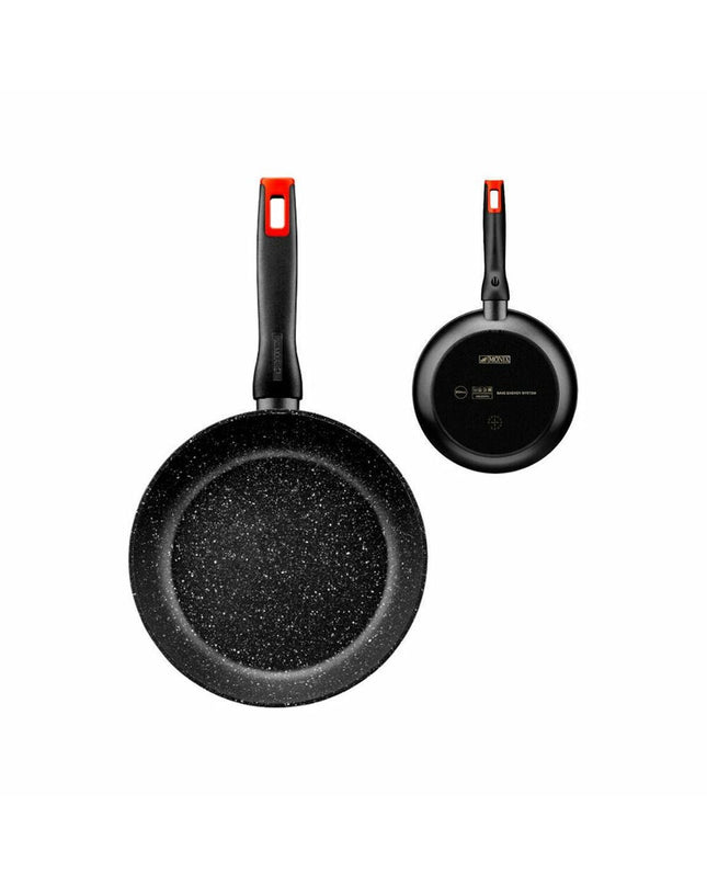 Monix aluminium pan for home cooking, showing a close-up of the pan's exterior with a sleek silver finish and ergonomic handle.