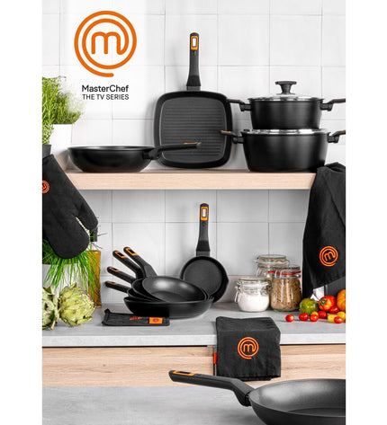 Set of four MasterChef kitchen pans with 2.5 mm thickness, shown stacked with handles visible, ideal for cooking and food preparation.