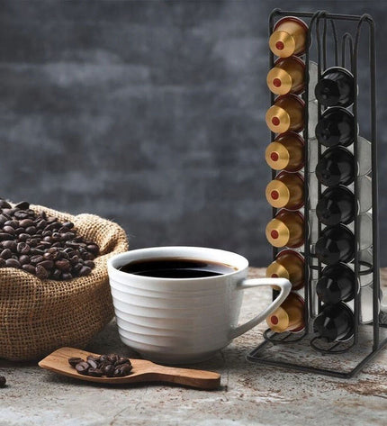 Quttin black iron coffee capsule organizer with 12 compartments for storing and organizing coffee capsules.