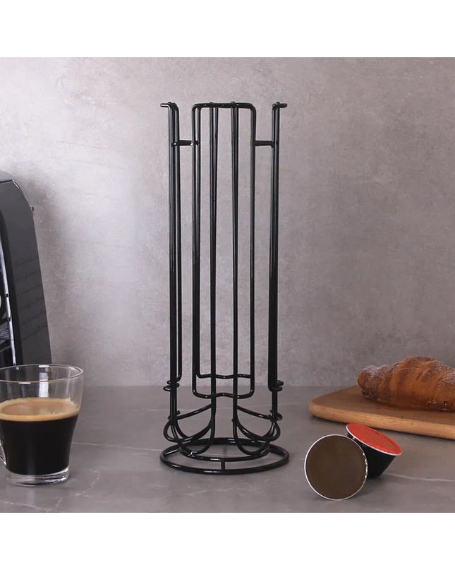 Quttin black iron coffee capsule organizer holding 12 capsules on kitchen countertop, compact 11.5 x 33 cm design.