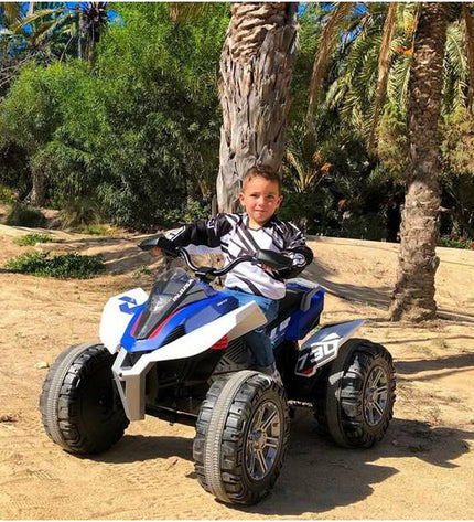 Blue and white Injusa Rage 12V electric quad toy, designed for outdoor play and sports, with realistic details and sturdy build.