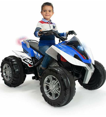 Blue and white Injusa Rage 12V electric quad toy for kids, featuring lights and rugged design for outdoor play.