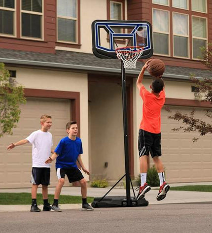 Lifetime basketball hoop for outdoor sport, showing the sturdy backboard and net in a sunny outdoor setting.