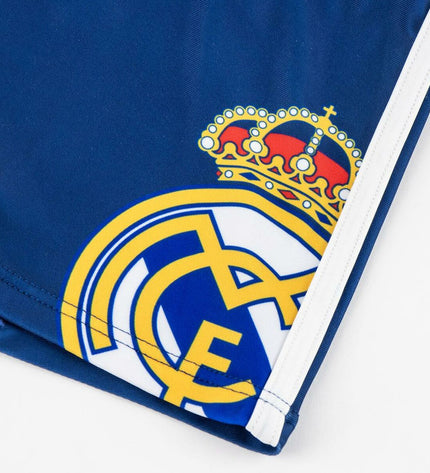 Dark blue boys' Real Madrid C.F. swim trunks for 4-year-olds, suitable for sports and outdoor water activities.