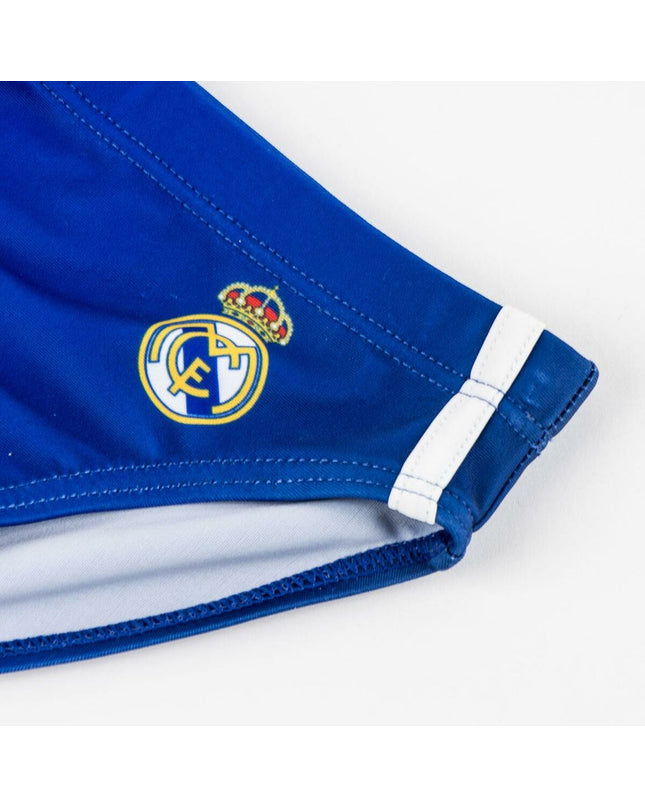 Children's Real Madrid C.F. dark blue sports and water swimwear, suitable for outdoor watersport activities, with team logo visible.