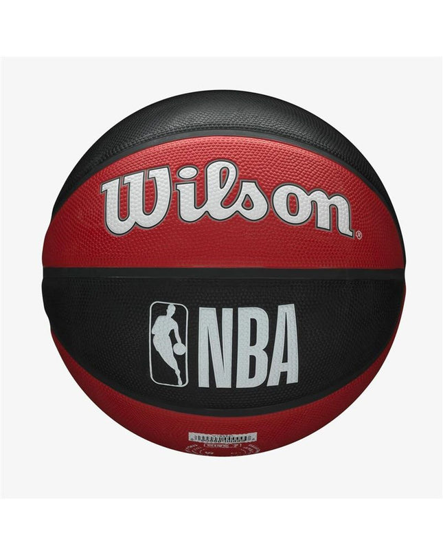 Wilson NBA Team black rubber basketball for outdoor play, featuring team logo and textured surface for grip.