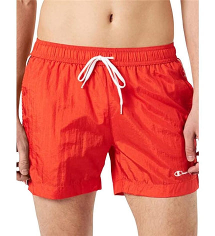 Red Champion men's swim trunks for sport and watersport, featuring a comfortable fit and sporty design.