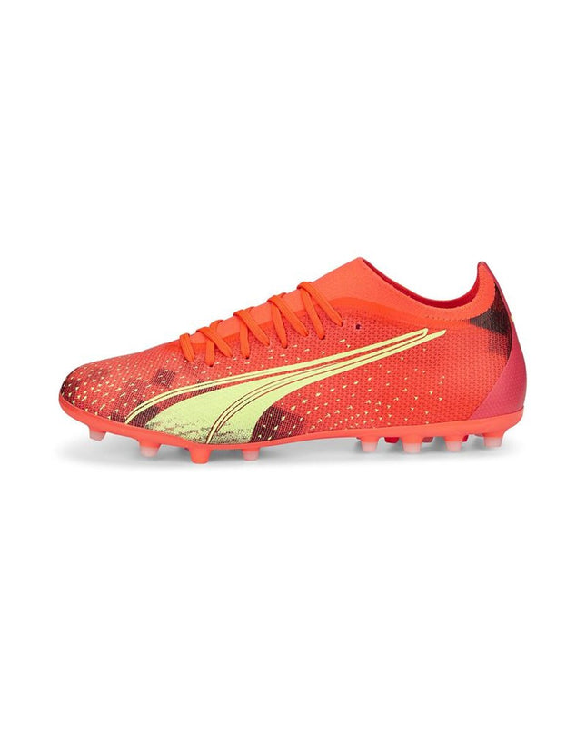 Orange Puma Ultra Match MG adult football cleats for outdoor soccer, showcasing the sporty design and grip features.