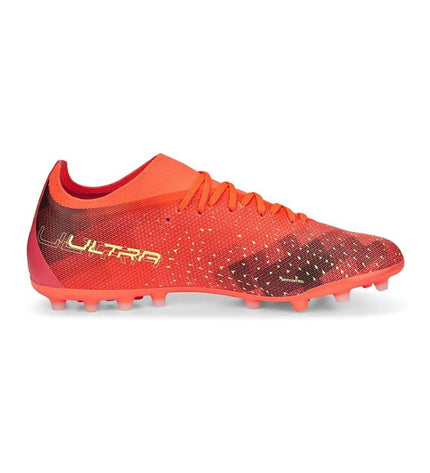 Orange Puma Ultra Match MG adult football cleats for outdoor soccer, featuring lightweight design and durable studs.