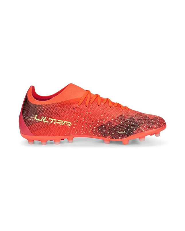 Orange Puma Ultra Match MG adult football cleats for outdoor soccer, featuring lightweight design and durable studs.